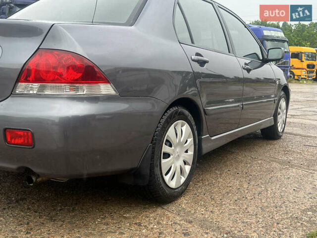 Серый Мицубиси Лансер, объемом двигателя 1.6 л и пробегом 193 тыс. км за 4700 $, фото 4 на Automoto.ua