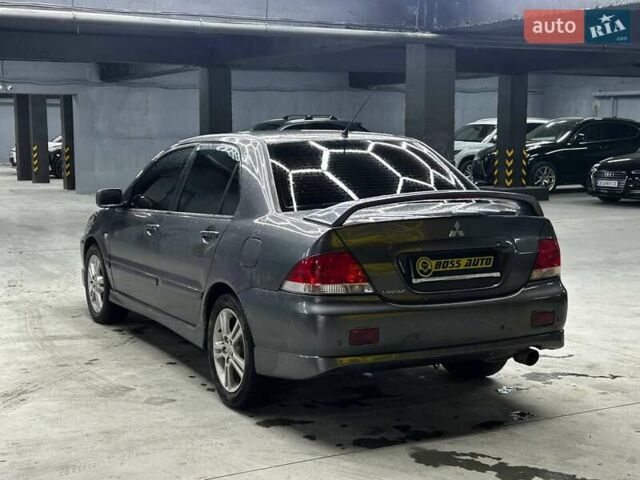 Серый Мицубиси Лансер, объемом двигателя 1.58 л и пробегом 300 тыс. км за 4600 $, фото 3 на Automoto.ua