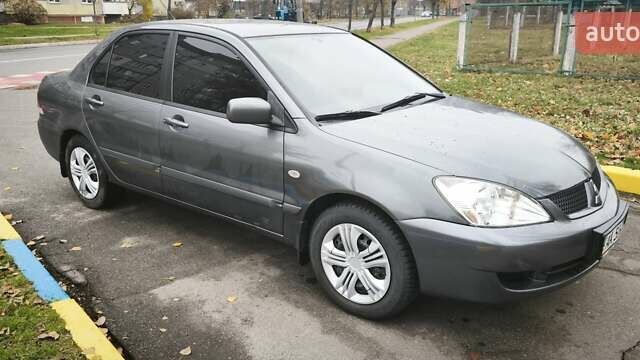 Серый Мицубиси Лансер, объемом двигателя 1.6 л и пробегом 263 тыс. км за 3800 $, фото 6 на Automoto.ua