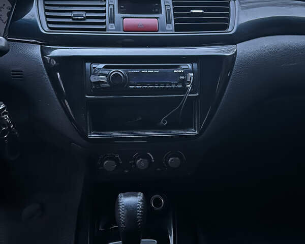 Сірий Міцубісі Lancer, об'ємом двигуна 2 л та пробігом 200 тис. км за 4999 $, фото 17 на Automoto.ua