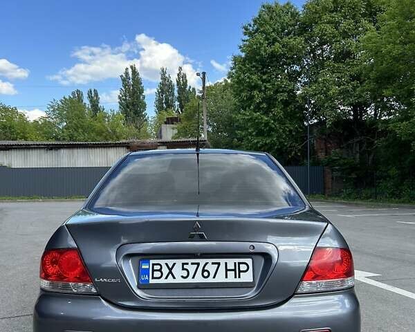 Сірий Міцубісі Lancer, об'ємом двигуна 1.58 л та пробігом 160 тис. км за 4600 $, фото 9 на Automoto.ua