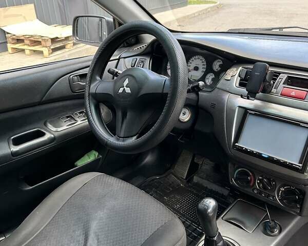 Сірий Міцубісі Lancer, об'ємом двигуна 1.58 л та пробігом 160 тис. км за 4600 $, фото 12 на Automoto.ua