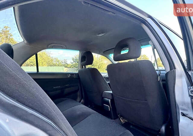 Сірий Міцубісі Lancer, об'ємом двигуна 1.6 л та пробігом 263 тис. км за 4900 $, фото 28 на Automoto.ua
