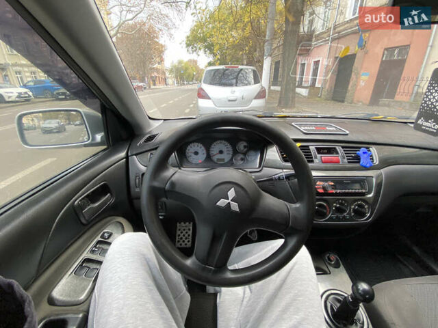 Серый Мицубиси Лансер, объемом двигателя 1.6 л и пробегом 444 тыс. км за 3400 $, фото 11 на Automoto.ua