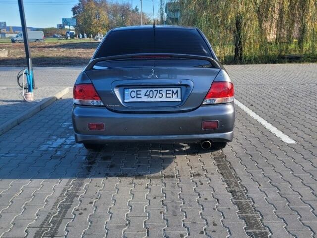 Мицубиси Лансер 2006 в Черновцах на Automoto.ua Серый Мицубиси Лансер, объемом двигателя 1.6 л и пробегом 263 тыс. км за 4500 $, фото 4 на Automoto.ua