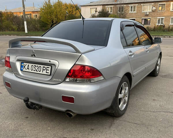 Сірий Міцубісі Lancer, об'ємом двигуна 1.58 л та пробігом 430 тис. км за 2550 $, фото 4 на Automoto.ua
