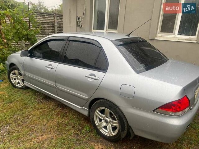 Сірий Міцубісі Lancer, об'ємом двигуна 1.58 л та пробігом 238 тис. км за 5000 $, фото 3 на Automoto.ua