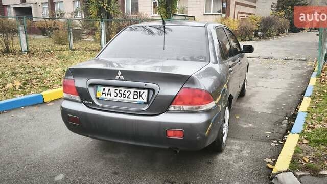 Серый Мицубиси Лансер, объемом двигателя 1.6 л и пробегом 263 тыс. км за 3800 $, фото 4 на Automoto.ua