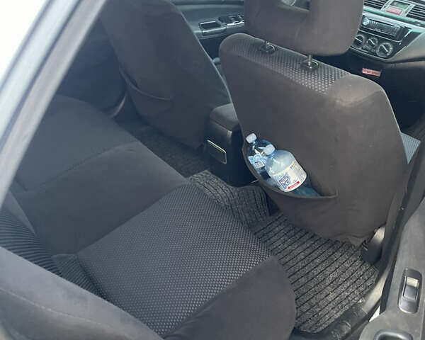 Сірий Міцубісі Lancer, об'ємом двигуна 1.58 л та пробігом 430 тис. км за 2550 $, фото 11 на Automoto.ua
