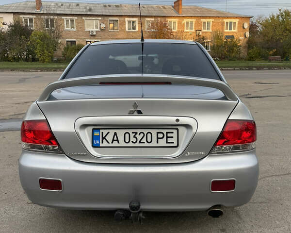 Сірий Міцубісі Lancer, об'ємом двигуна 1.58 л та пробігом 430 тис. км за 2550 $, фото 5 на Automoto.ua