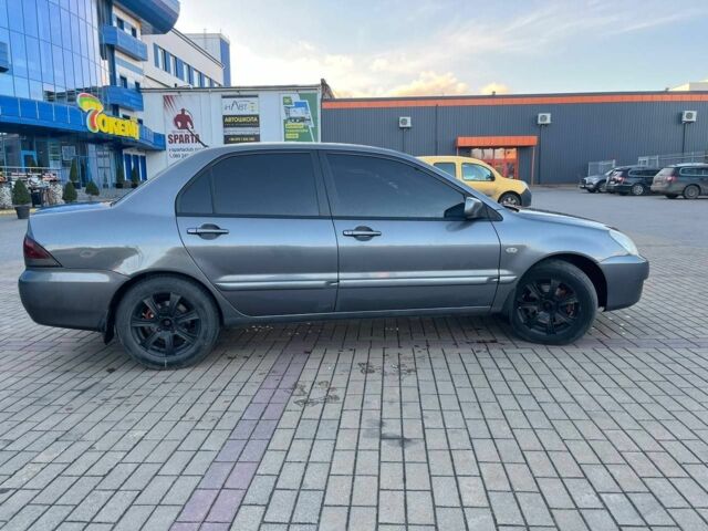 Серый Мицубиси Лансер, объемом двигателя 1.6 л и пробегом 279 тыс. км за 3990 $, фото 4 на Automoto.ua