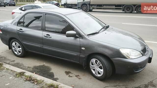 Серый Мицубиси Лансер, объемом двигателя 1.6 л и пробегом 263 тыс. км за 3650 $, фото 3 на Automoto.ua