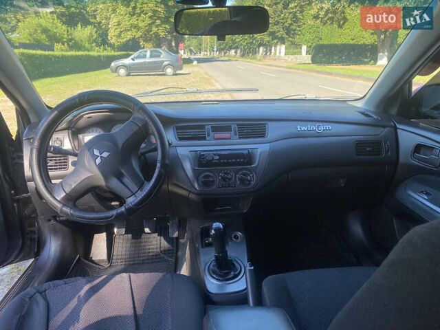 Серый Мицубиси Лансер, объемом двигателя 1.6 л и пробегом 291 тыс. км за 3900 $, фото 5 на Automoto.ua