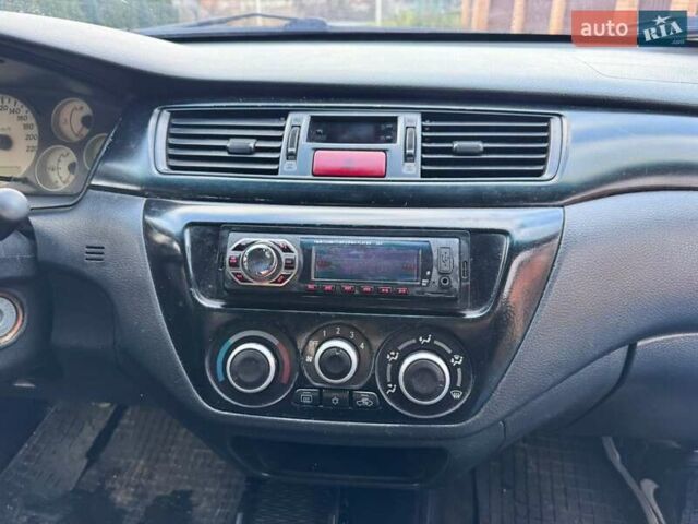 Сірий Міцубісі Lancer, об'ємом двигуна 1.58 л та пробігом 333 тис. км за 2999 $, фото 12 на Automoto.ua
