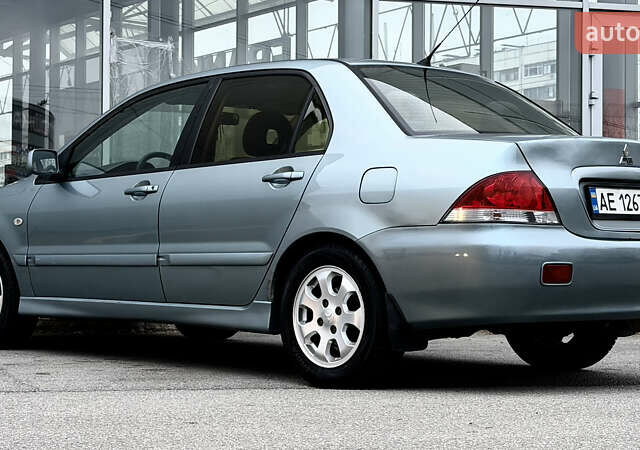 Сірий Міцубісі Lancer, об'ємом двигуна 1.58 л та пробігом 275 тис. км за 4600 $, фото 2 на Automoto.ua