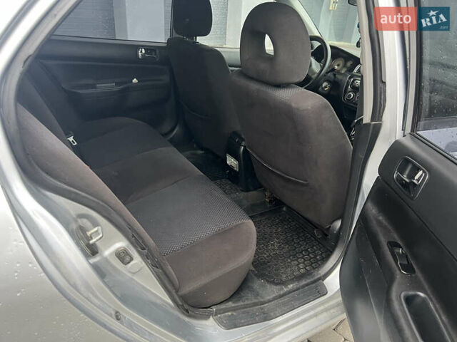Сірий Міцубісі Lancer, об'ємом двигуна 1.58 л та пробігом 333 тис. км за 2450 $, фото 20 на Automoto.ua