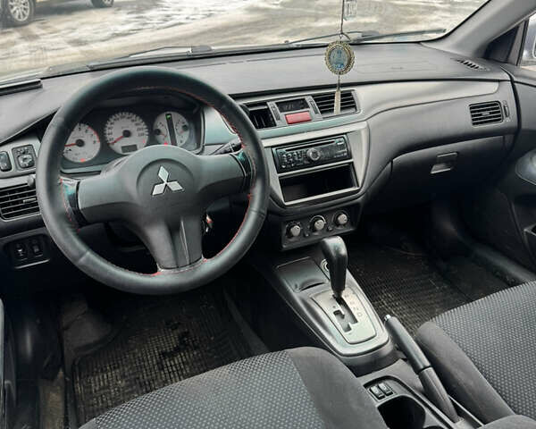 Серый Мицубиси Лансер, объемом двигателя 1.58 л и пробегом 220 тыс. км за 3990 $, фото 5 на Automoto.ua