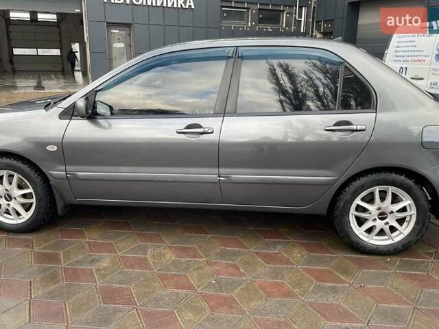 Сірий Міцубісі Lancer, об'ємом двигуна 1.6 л та пробігом 262 тис. км за 4400 $, фото 7 на Automoto.ua