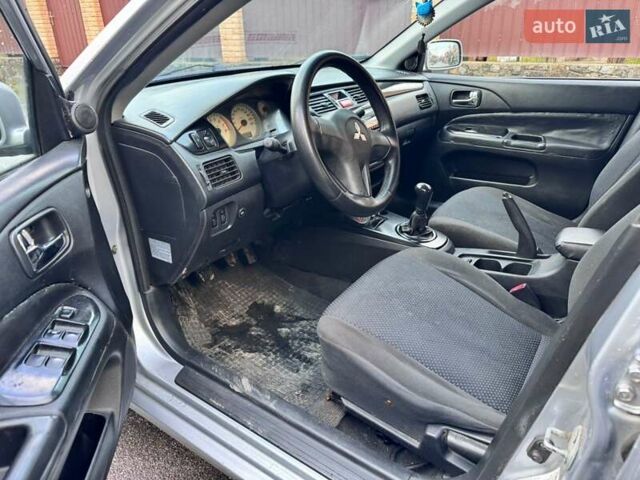 Сірий Міцубісі Lancer, об'ємом двигуна 1.58 л та пробігом 333 тис. км за 2999 $, фото 9 на Automoto.ua