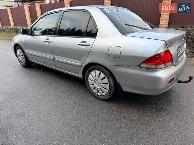 Сірий Міцубісі Lancer, об'ємом двигуна 1.58 л та пробігом 333 тис. км за 2999 $, фото 5 на Automoto.ua