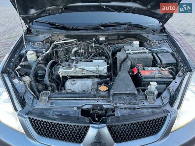 Серый Мицубиси Лансер, объемом двигателя 1.6 л и пробегом 279 тыс. км за 3990 $, фото 14 на Automoto.ua