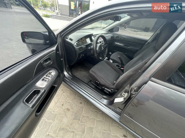 Сірий Міцубісі Lancer, об'ємом двигуна 1.58 л та пробігом 162 тис. км за 4650 $, фото 9 на Automoto.ua