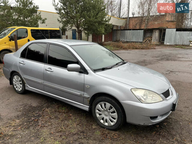 Сірий Міцубісі Lancer, об'ємом двигуна 1.58 л та пробігом 308 тис. км за 3700 $, фото 8 на Automoto.ua