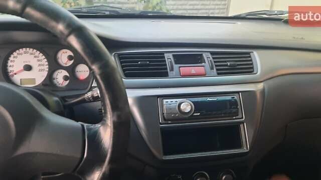 Сірий Міцубісі Lancer, об'ємом двигуна 1.58 л та пробігом 238 тис. км за 5000 $, фото 8 на Automoto.ua