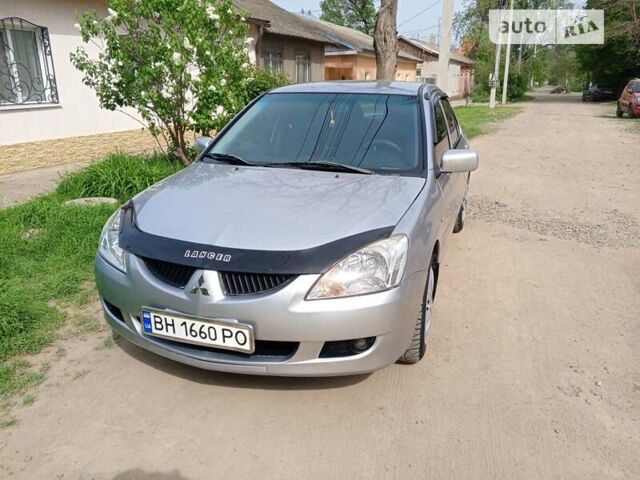 Сірий Міцубісі Lancer, об'ємом двигуна 1.59 л та пробігом 217 тис. км за 4600 $, фото 4 на Automoto.ua