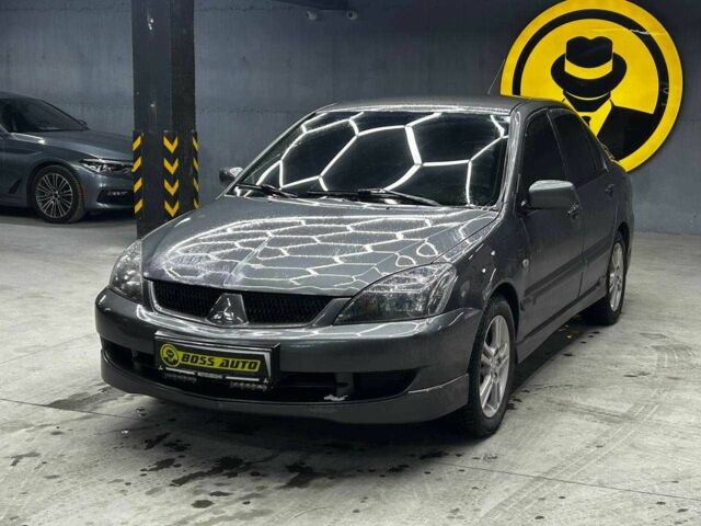 Серый Мицубиси Лансер, объемом двигателя 1.6 л и пробегом 300 тыс. км за 4600 $, фото 2 на Automoto.ua