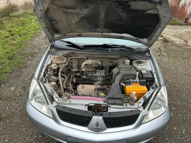 Сірий Міцубісі Lancer, об'ємом двигуна 1.6 л та пробігом 270 тис. км за 2900 $, фото 18 на Automoto.ua