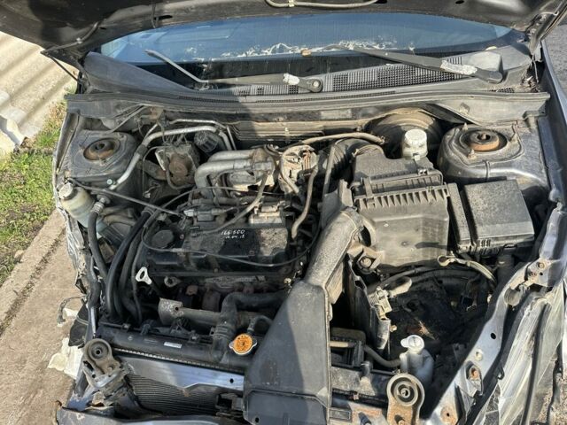 Сірий Міцубісі Lancer, об'ємом двигуна 1.6 л та пробігом 200 тис. км за 1150 $, фото 7 на Automoto.ua