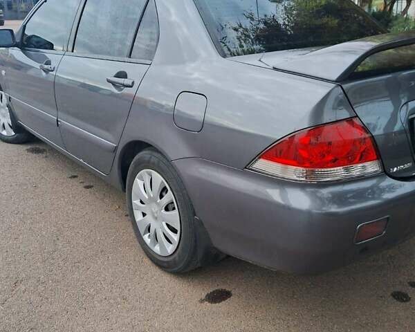 Сірий Міцубісі Lancer, об'ємом двигуна 1.6 л та пробігом 229 тис. км за 4900 $, фото 6 на Automoto.ua