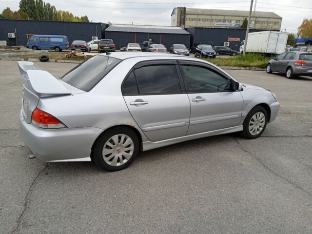 Сірий Міцубісі Lancer, об'ємом двигуна 1.6 л та пробігом 300 тис. км за 2999 $, фото 4 на Automoto.ua
