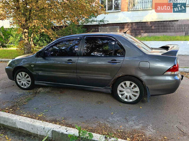 Серый Мицубиси Лансер, объемом двигателя 1.6 л и пробегом 220 тыс. км за 2750 $, фото 8 на Automoto.ua