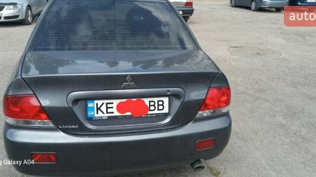 Серый Мицубиси Лансер, объемом двигателя 1.58 л и пробегом 271 тыс. км за 4600 $, фото 3 на Automoto.ua