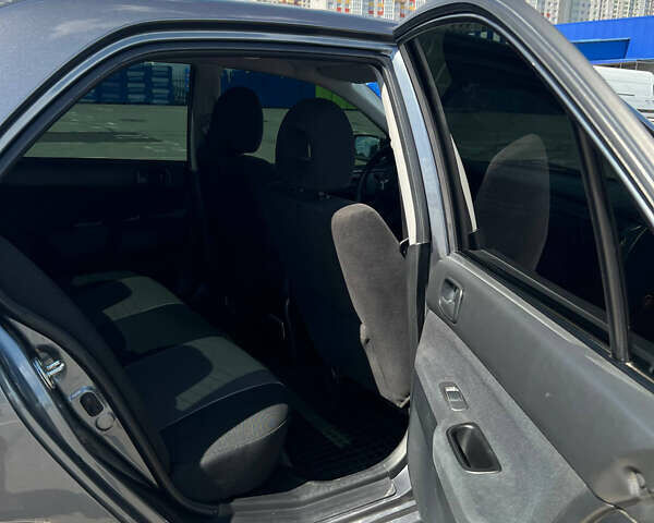 Сірий Міцубісі Lancer, об'ємом двигуна 1.6 л та пробігом 223 тис. км за 4500 $, фото 12 на Automoto.ua