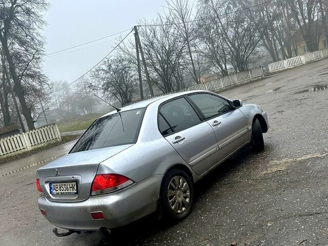 Серый Мицубиси Лансер, объемом двигателя 1.6 л и пробегом 123 тыс. км за 4000 $, фото 5 на Automoto.ua