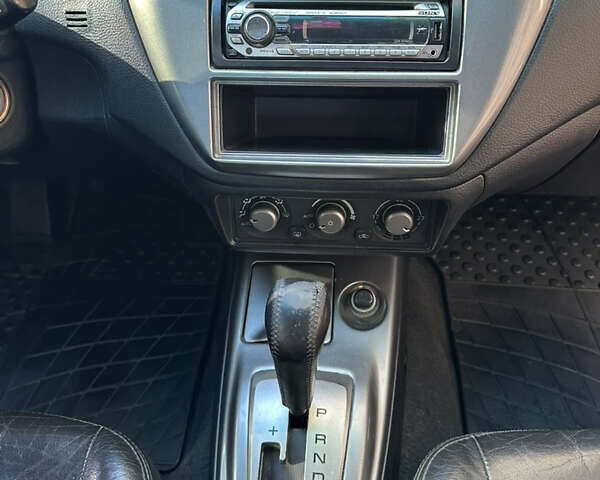 Серый Мицубиси Лансер, объемом двигателя 1.58 л и пробегом 244 тыс. км за 4950 $, фото 13 на Automoto.ua