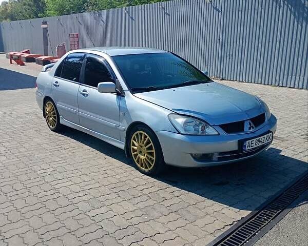 Сірий Міцубісі Lancer, об'ємом двигуна 1.58 л та пробігом 265 тис. км за 2900 $, фото 1 на Automoto.ua