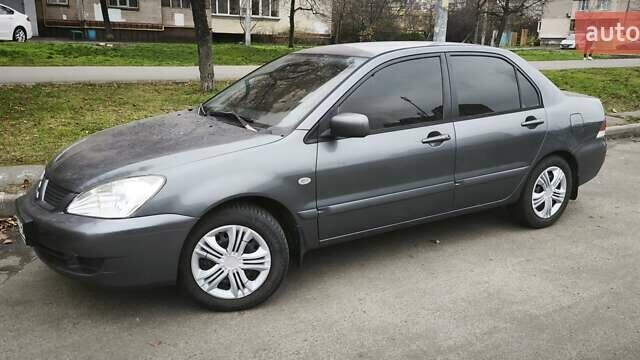 Серый Мицубиси Лансер, объемом двигателя 1.6 л и пробегом 263 тыс. км за 3650 $, фото 4 на Automoto.ua