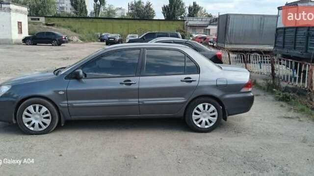 Серый Мицубиси Лансер, объемом двигателя 1.58 л и пробегом 271 тыс. км за 4600 $, фото 2 на Automoto.ua