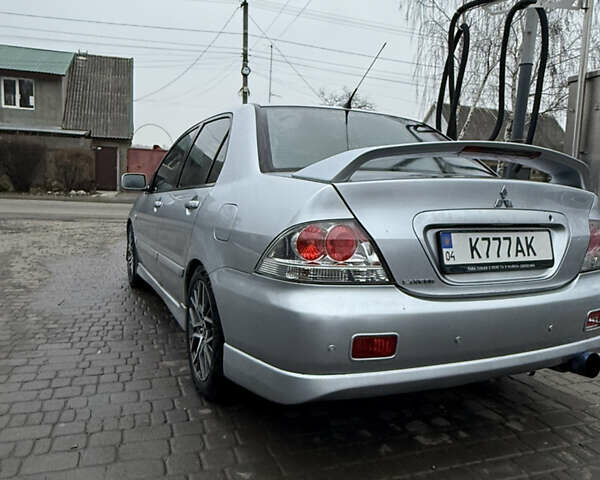 Серый Мицубиси Лансер, объемом двигателя 2 л и пробегом 256 тыс. км за 7000 $, фото 2 на Automoto.ua