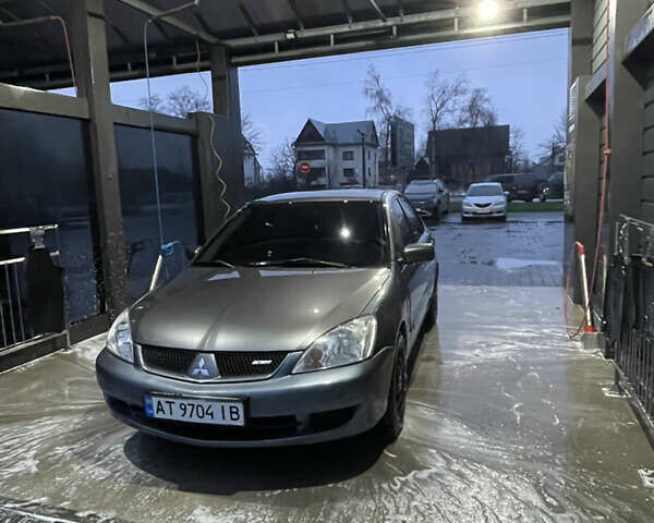 Серый Мицубиси Лансер, объемом двигателя 1.6 л и пробегом 213 тыс. км за 4500 $, фото 1 на Automoto.ua
