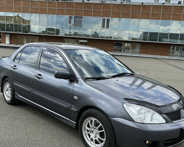 Сірий Міцубісі Lancer, об'ємом двигуна 1.6 л та пробігом 260 тис. км за 4998 $, фото 12 на Automoto.ua