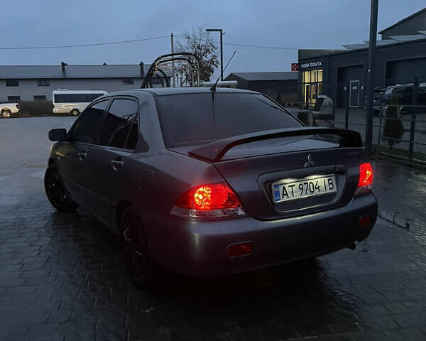 Серый Мицубиси Лансер, объемом двигателя 1.6 л и пробегом 213 тыс. км за 4500 $, фото 2 на Automoto.ua