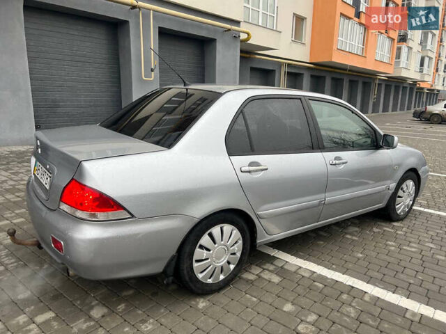 Сірий Міцубісі Lancer, об'ємом двигуна 1.58 л та пробігом 333 тис. км за 2999 $, фото 5 на Automoto.ua