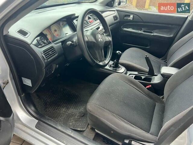 Серый Мицубиси Лансер, объемом двигателя 1.6 л и пробегом 333 тыс. км за 2800 $, фото 13 на Automoto.ua