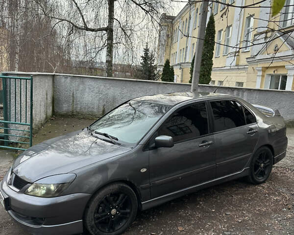 Сірий Міцубісі Lancer, об'ємом двигуна 2 л та пробігом 200 тис. км за 4999 $, фото 5 на Automoto.ua