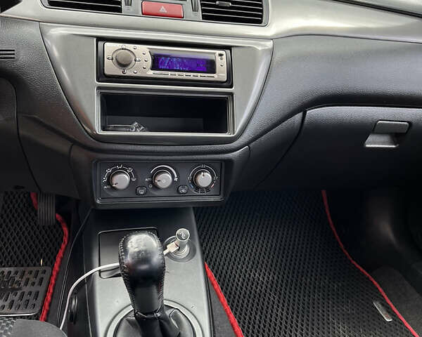 Сірий Міцубісі Lancer, об'ємом двигуна 1.6 л та пробігом 260 тис. км за 4998 $, фото 7 на Automoto.ua